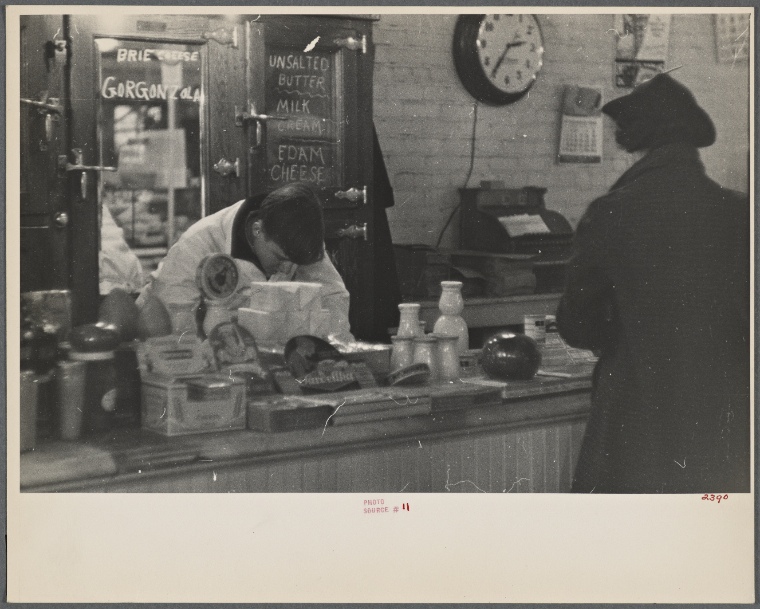Interior of a grocery store showing the cheese and dairy counter