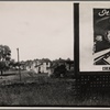 Houses with partial view of billboard advertising Coca-Cola in foreground. West Virginia?