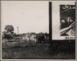 Houses with partial view of billboard advertising Coca-Cola in foreground. West Virginia?