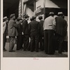 San Francisco, California. In front of the local paper at Chinatown. Chinese reading news of the surrender of Canton to the Japanese. Most of San Francisco's Chinese are Cantonese