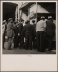 San Francisco, California. In front of the local paper at Chinatown. Chinese reading news of the surrender of Canton to the Japanese. Most of San Francisco's Chinese are Cantonese