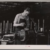 Jack Cutter, resident of FSA (Farm Security Administration) trailer camp, winding an armature at General Electric plant. Erie, Pennsylvania.