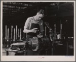 Jack Cutter, resident of FSA (Farm Security Administration) trailer camp, winding an armature at General Electric plant. Erie, Pennsylvania.