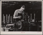 Jack Cutter, resident of FSA (Farm Security Administration) trailer camp, winding an armature at General Electric plant. Erie, Pennsylvania.