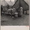 Disposal of garbage and dirty dishes. Tent City, near Shawneetown, Illinois