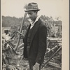 Man with ax and woodpile