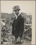 Man with ax and woodpile