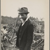 Man with ax and woodpile