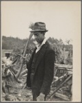 Man with ax and woodpile