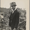 Man with ax and woodpile