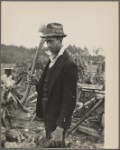 Man with ax and woodpile