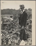 Man with ax and woodpile
