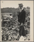 Man with ax and woodpile