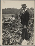 Man with ax and woodpile