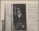 Man with cigarette in a doorway