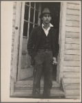 Man with cigarette in doorway