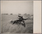 Farm machinery almost buried by sand. Cimarron County, Oklahoma