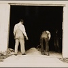 Farmers mixing grasshopper bait with assistance of the county supervisor. Outskirts of Oklahoma City, Oklahoma