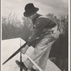 Carpenter working on the roof of the first shelter near the lake site of the Berwyn project, [Greenbelt,] Maryland.