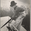 Carpenter working on the roof of the first shelter near the lake site of the Berwyn project, [Greenbelt,] Maryland.