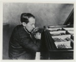 Henry Cowell playing the piano