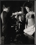 Ray Milland [center] and unidentified others in the stage production Hostile Witness