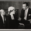 Ray Milland [right] and unidentified others in the stage production Hostile Witness