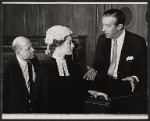 Ray Milland [right] and unidentified others in the stage production Hostile Witness