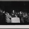 Shirley Booth [seated] and Melvyn Douglas [standing at center] and unidentified others in the stage production Juno