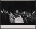 Shirley Booth [seated] and Melvyn Douglas [standing at center] and unidentified others in the stage production Juno