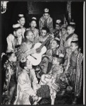 Yul Brynner and ensemble of child performers in publicity pose for the 1951 Broadway production of The King and I