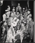 Yul Brynner and ensemble of child performers in publicity photo for the 1951 Broadway production of The King and I