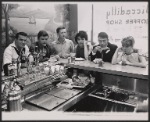 Publicity photo of Burt Reynolds, Clinton Kimbrough, Ralph Williams, Zohra Lampert, Zack Matalon, and Collin Wilcox from the stage production Look, We've Come Through at a coffee shop