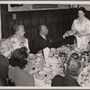 Father Divine at a banquet