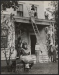 Patty Duke [seated at left], Anne Bancroft [on roof above], Andrew Prine [in jacket at base of ladder] and unidentified others in the 1962 motion picture version of The Miracle Worker