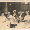 Ada "Bricktop" Smith (far left) seated at table with other women