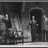 Noel Coward [center] and unidentified others in the stage production Nude with Violin