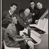 Joe Bova [at left], Mary Rodgers [at piano], George Abbott [center] and unidentified others in rehearsal for the stage production Once Upon a Mattress