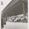 Street vendors underneath the elevated train line near the corner of West 145th Street and Ninth Avenue, Harlem, New York, 1939