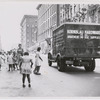 Group of young girls wait for truck to pass by during series of street games, sponsored by the Police Athletic League, Harlem, New York City, 1949