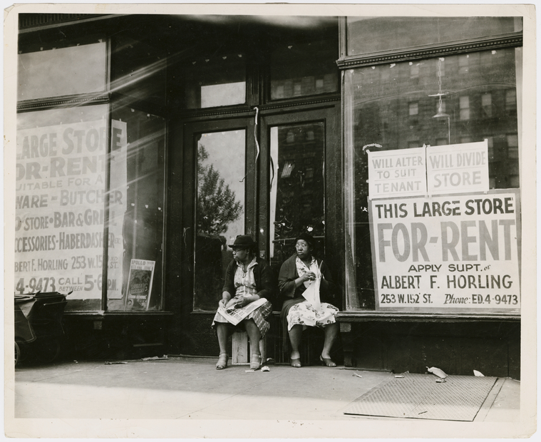 Sidewalk Sitters Two Women Sitting In Doorway Of Empty Storefront That Is Being Offered For