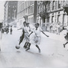 View of young girls kicking a ball during a Police Athletic League (PAL) sponsored street game, Harlem, New York City, 1949