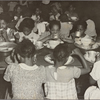 Groups of children eating at tables