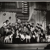 Stanley Prager [with glasses kneeling fourth from left], Thelma Pelish [center in grey suit] and ensemble in the stage production The Pajama Game