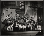 Stanley Prager [with glasses kneeling fourth from left], Thelma Pelish [center in grey suit] and ensemble in the stage production of The Pajama Game