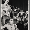 Dave Ringland [background left with guitar], Nick Rawson [foreground with guitar], Elizabeth Herring [right with trumpet] and unidentified [with flute] in the 1969 stage production Stomp