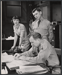 Allyn Ann McLerie [left], Arthur Kennedy [seated] and unidentified [standing in center] in the stage production Time Limit!