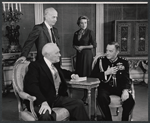 Maurice Evans (seated right) and unidentified cast members in the stage production The Apple Cart