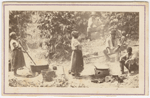 Carte-de-visite view of a group of men, women and boys standing or seated around boiling pots and tubs, Brazil, n.d.