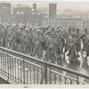 369th Infantry Regiment in march formation, crossing a bridge in New York City, circa 1917